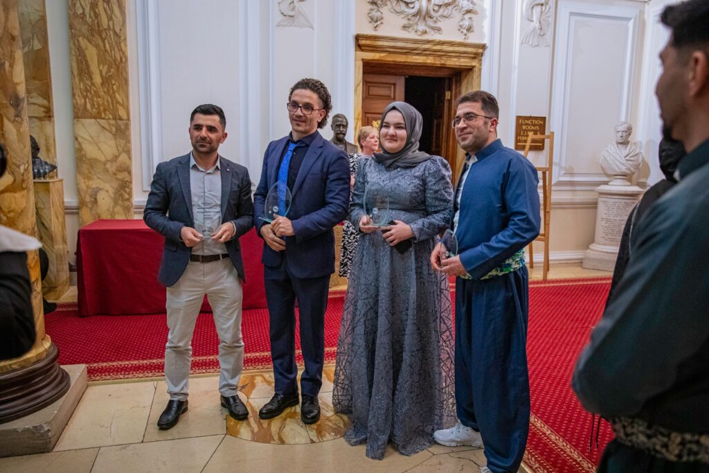 Fatma after receiving her award for the Leader of the Future from Welsh Refugee Council