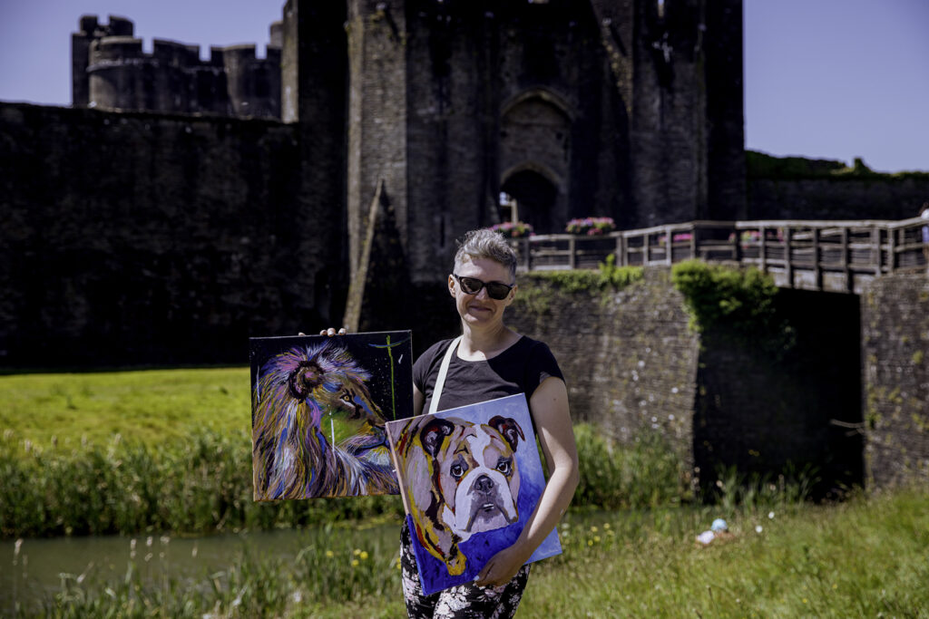 Aga and her paintings for her first art exhibition